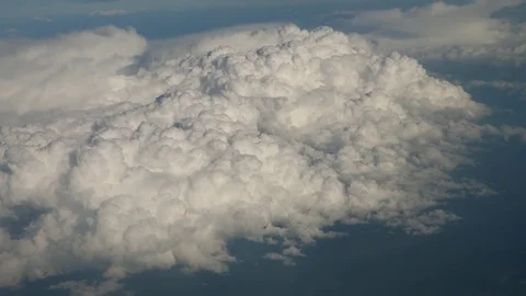 View From Airplane Flying Above the Clouds Landscape At High Altitude Stock Footage 80715147