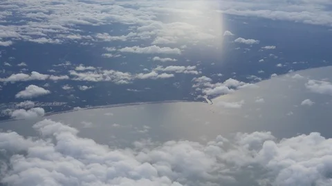View from airplane. flying over cloud and Land. Видео 93109054