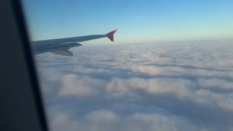 View from airplane flying over thick clouds Stock Footage 262365195