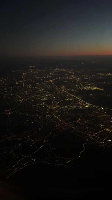 View from airplane flying over Vienna at sunrise. Vertical video Stock Footage 262365056