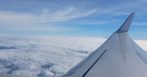 View from airplane over clouds Stock Footage 100489669