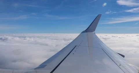View from airplane over clouds Stock Footage 100489885