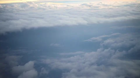 View from an airplane of sky and clouds as sun falls down Stock Footage 49127261