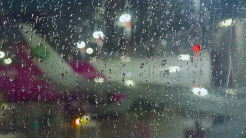 View from the airplane through the window with raindrops Stock Footage 314661864