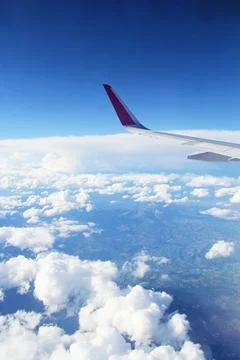 View from Airplane with White Clouds Stock-Fotos