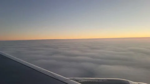 View from an airplane window above the clouds Stock Footage 236312282