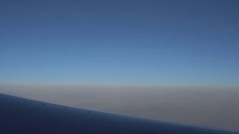 The view from the airplane window. beautiful blue sky Stock Footage 81888388