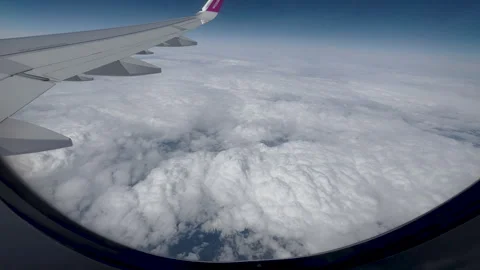 View from airplane window beautiful clouds from up Stock-Footage 242589798