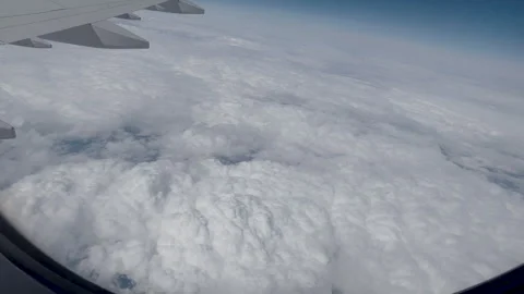 View from airplane window beautiful clouds from up Stock-Footage 242589799