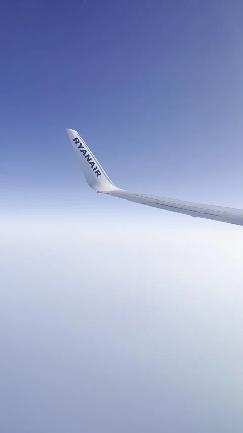 View from the airplane window. Beautiful cloudscape with blue sky.  Stock Footage 244240866