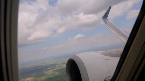 View from the airplane window on the beautiful fluffy clouds. Stock Footage 130473286