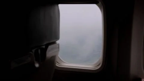 View from the airplane window on the beautiful fluffy clouds. Stock Footage 130517866