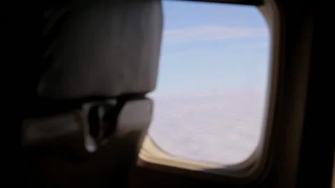 View from the airplane window on the beautiful fluffy clouds. 库存影片 130517931
