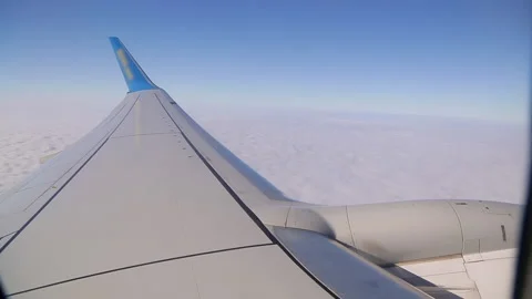 View from the airplane window on the beautiful fluffy clouds. Stock Footage 130517956