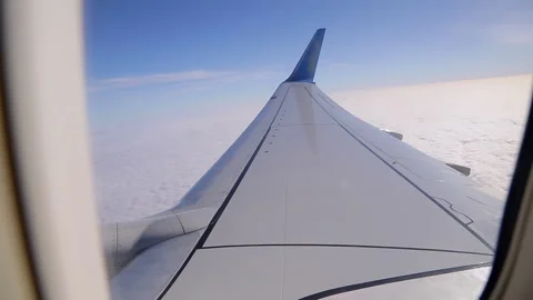 View from the airplane window on the beautiful fluffy clouds. Video stock 130518036