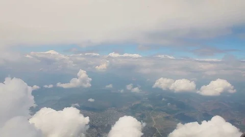View from airplane window, Beautiful snow-white clouds from the airplane window Stock Footage