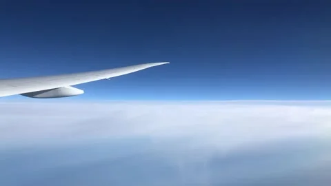 View from the airplane window on blue sky and clouds 스톡 동영상 148550252