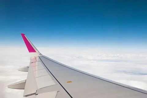 View from airplane window with blue sky Stock Photos