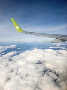 View from airplane window on the blue sky Stock Photos