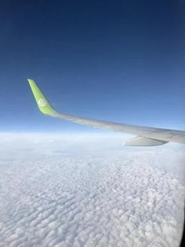 View from airplane window on the blue sky Stock Photos