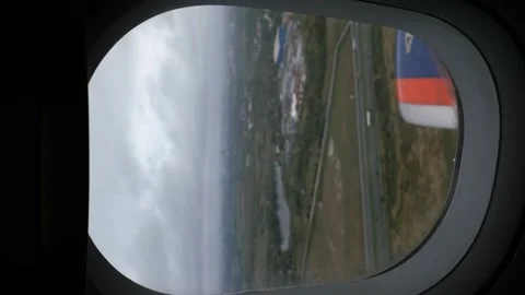 View from the airplane window in blur. focus on travel with porthole and air Stock Footage 165147404