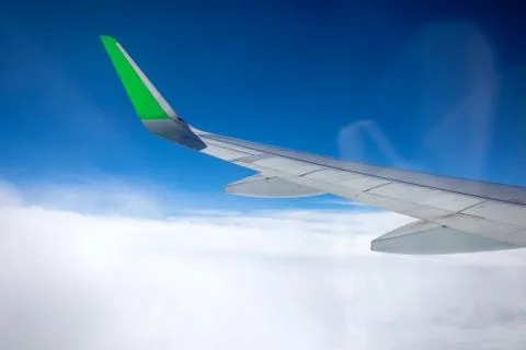 The view from the airplane window on the clouds and the blue sky, you can see Foto stock
