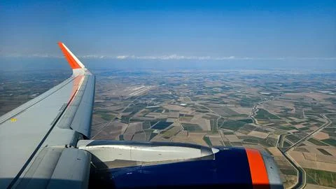 View from airplane window with clouds and blue sky Stock Photos