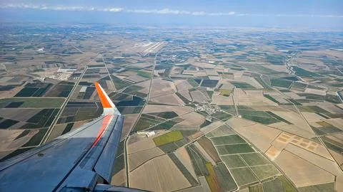 View from airplane window with clouds and blue sky Stock Photos