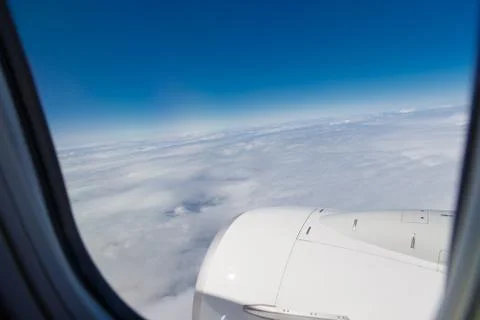 A view from the airplane window to clouds. Stock Photos