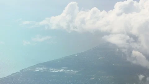 View From Airplane Window Of Coastline Clouds Stock-Footage 102501003