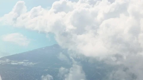 View From Airplane Window Of Coastline Moving Into Clouds Transition 스톡 동영상 102500996