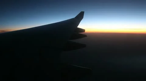 View from the airplane window. Dawn. Video stock 13971930