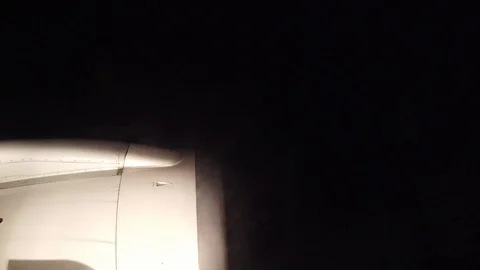 View from airplane window during landing at night Stock Footage 121189380
