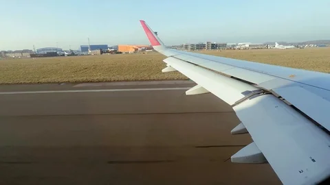 View from the airplane window during takeoff in sunny February weather Stock Footage 102527974