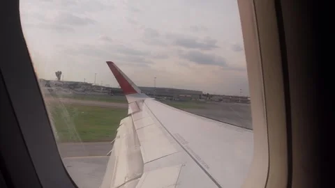 View from an airplane window during takeoff, Moscow, April 13, 2024 Stock Footage 272219681