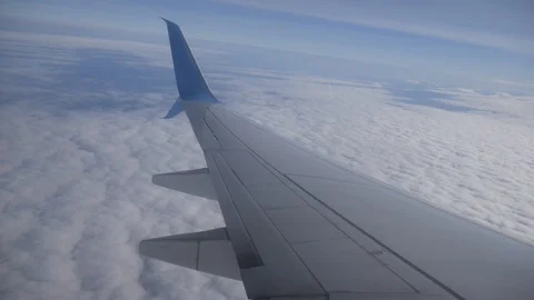The view from the airplane window on the fluffy clouds Stock Footage 127734383