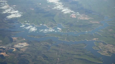 View from airplane window. Fly over land and clouds. Stock Footage 157206371