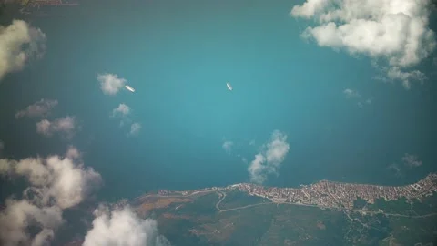 View from airplane window. Fly over land and clouds. Vídeo Stock 157209320