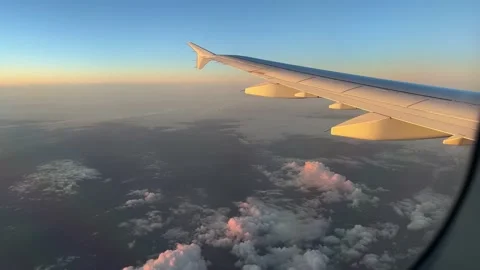 View from airplane window in golden hour Stock Footage 227130734