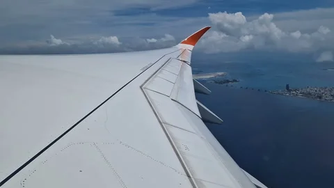 View from the airplane window to the Indian Ocean and the atoll. Maldives Stock Footage 309291850