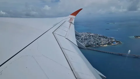 View from the airplane window to the Indian Ocean and the atoll. Maldives Stock Footage 309291954