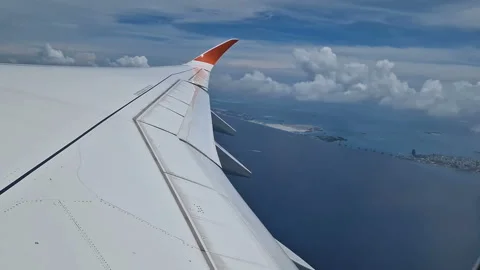 View from the airplane window to the Indian Ocean and the atoll. Maldives Stock Footage 309292080