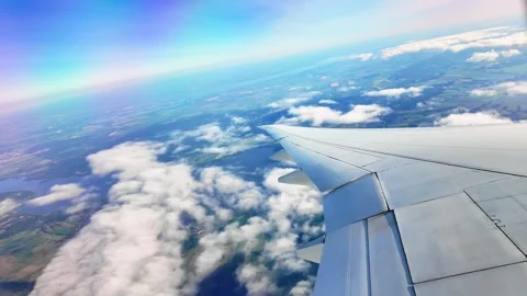 View from the airplane window as it climbs through the clouds Stock Footage 287889031