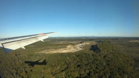 View from airplane window. looking at airplane shadow, landing Hokkaido airport. Stock Footage 119300883