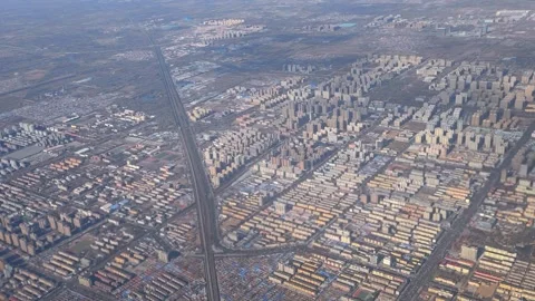 View from airplane window on multi-story buildings of Beijing. Stock Footage 344175328