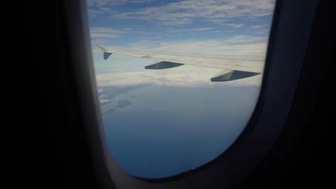 View from an airplane window on the ocean. Stock Footage 115700732