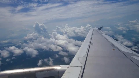 A view from the airplane window over the wings and engines. The planes are fl Stock Footage 80105568
