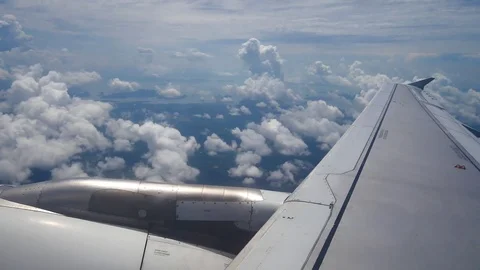 A view from the airplane window over the wings and engines. The planes are fl Stock Footage 80105601