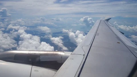 A view from the airplane window over the wings and engines. The planes are fl Stock Footage 80105818