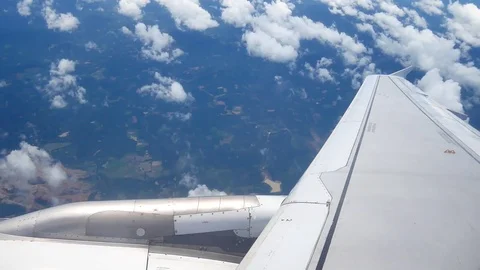 A view from the airplane window over the wings and engines. The planes are fl Stock Footage 80106004